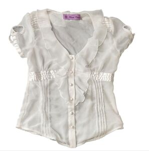 White Ruffled Blouse by The French Closet